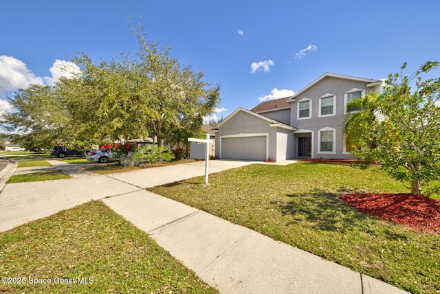 traditional-style house featuring a garage, stucco siding, concrete driveway, and a front yard