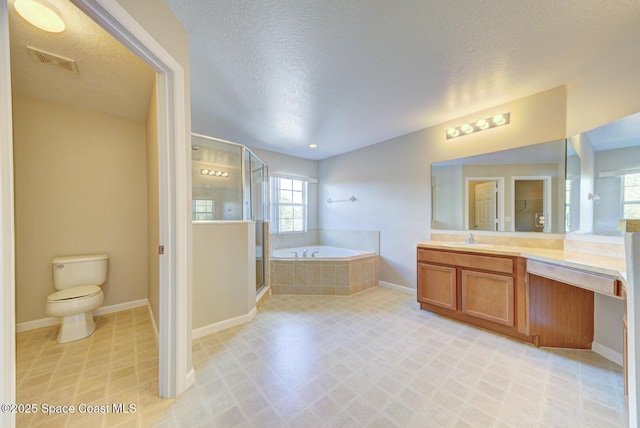 full bathroom with a garden tub, visible vents, toilet, a shower stall, and vanity