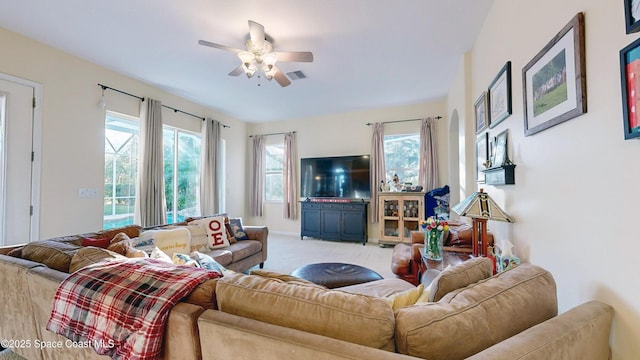 living room with ceiling fan and light carpet