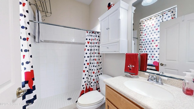 bathroom with curtained shower, vanity, and toilet