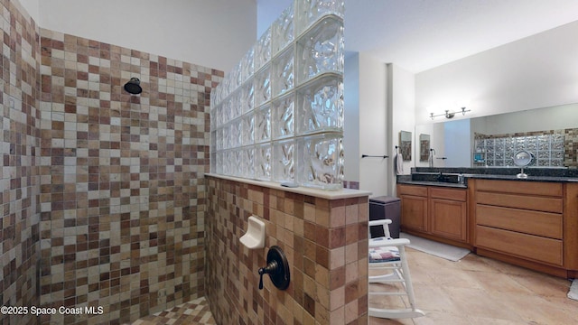 bathroom with vanity and walk in shower