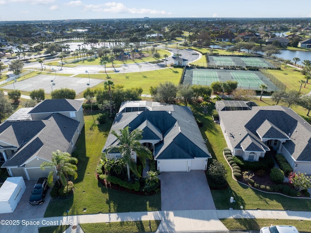 birds eye view of property with a water view