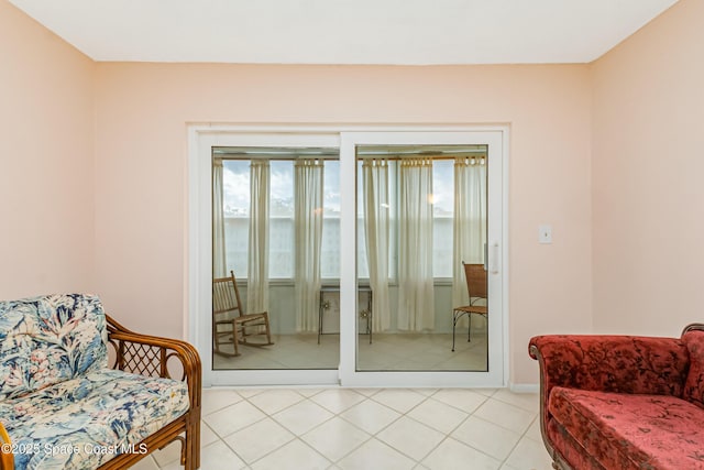 doorway with light tile patterned floors