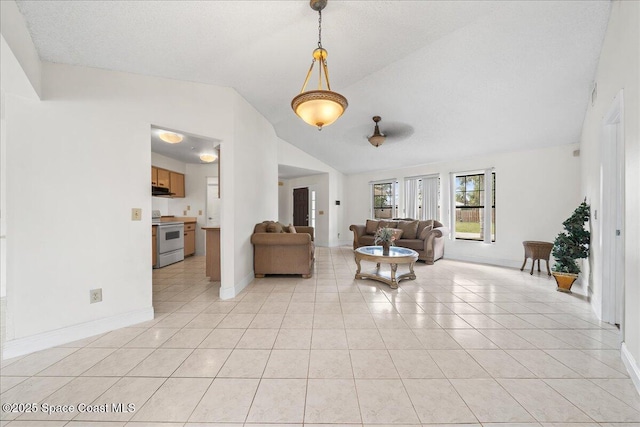 tiled living room with a textured ceiling, ceiling fan, and lofted ceiling