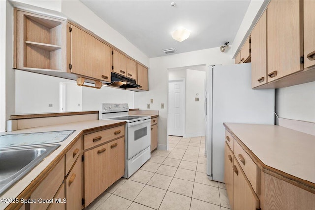 kitchen with light brown cabinetry, light tile patterned floors, extractor fan, and white appliances