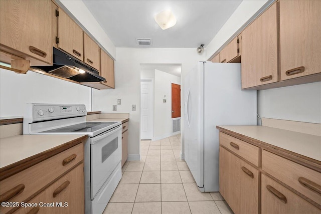 kitchen featuring light tile patterned flooring, white appliances, and light brown cabinetry