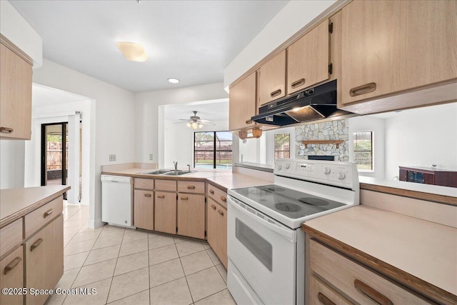 kitchen featuring ceiling fan, a wealth of natural light, white appliances, and light tile patterned floors