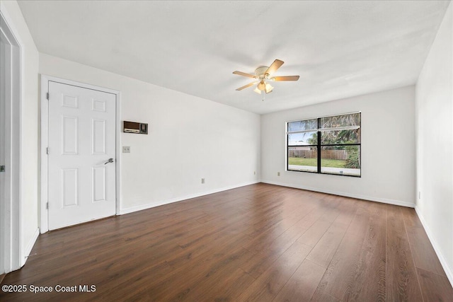 unfurnished room featuring dark hardwood / wood-style flooring and ceiling fan