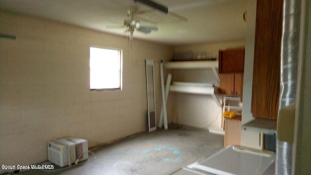 kitchen featuring concrete floors and brown cabinetry