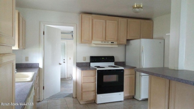 kitchen featuring light brown cabinetry, range with electric cooktop, ventilation hood, and freestanding refrigerator