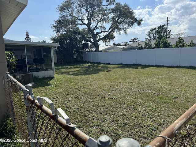 view of yard with a sunroom