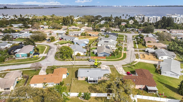 bird's eye view with a residential view and a water view