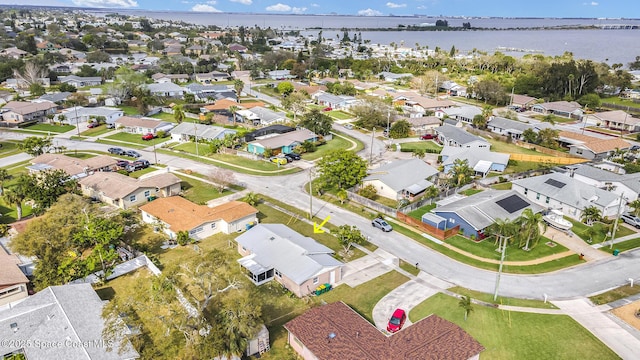 aerial view with a water view and a residential view