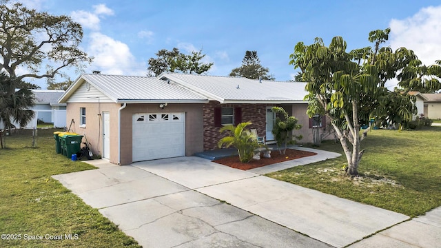 ranch-style house featuring an attached garage, metal roof, driveway, and a front lawn