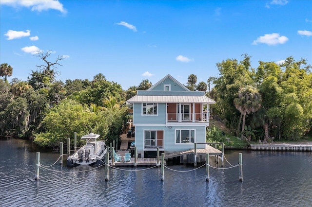 back of house with a water view