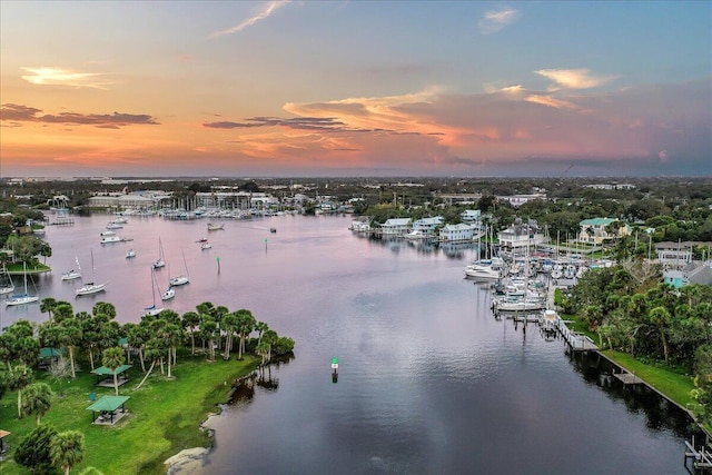 aerial view at dusk with a water view