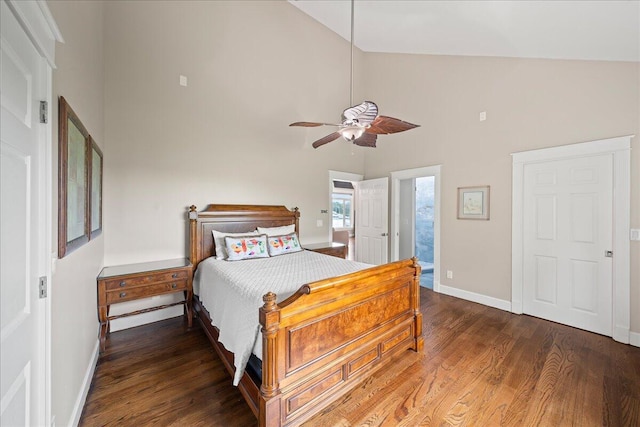 bedroom with ceiling fan, connected bathroom, dark hardwood / wood-style floors, and high vaulted ceiling