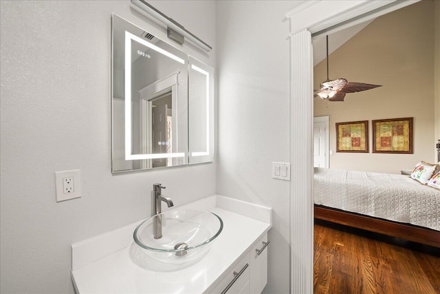 bathroom featuring hardwood / wood-style floors, ceiling fan, and vanity