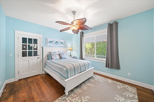 bedroom with ceiling fan and dark hardwood / wood-style flooring