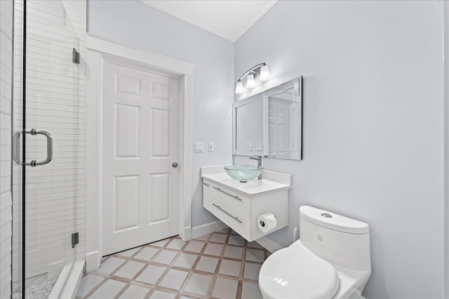 bathroom featuring toilet, tile patterned flooring, an enclosed shower, and vanity