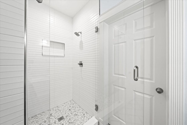 bathroom featuring an enclosed shower