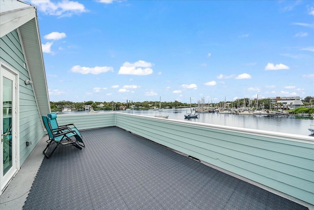 balcony featuring a water view