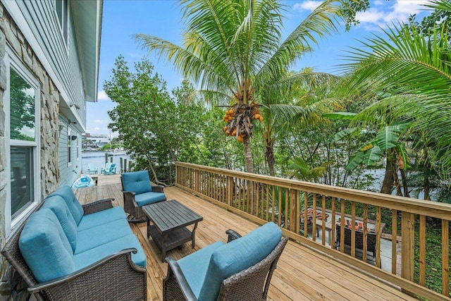 wooden terrace featuring an outdoor living space