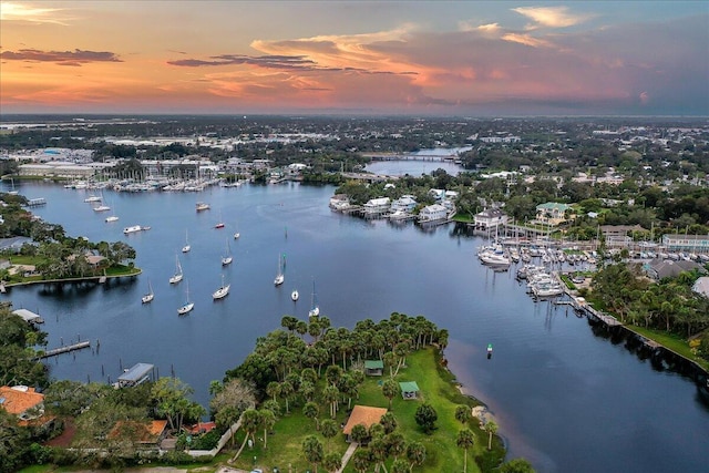 aerial view at dusk with a water view