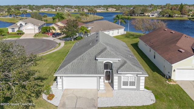 birds eye view of property with a water view