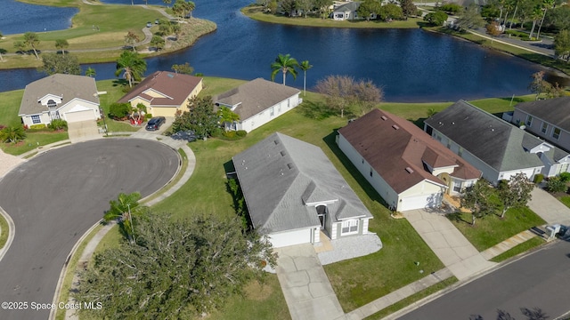 drone / aerial view with a water view