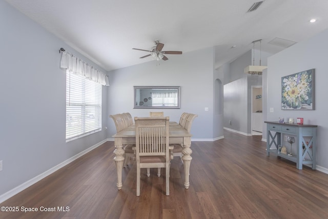 dining space featuring ceiling fan, dark hardwood / wood-style floors, and lofted ceiling