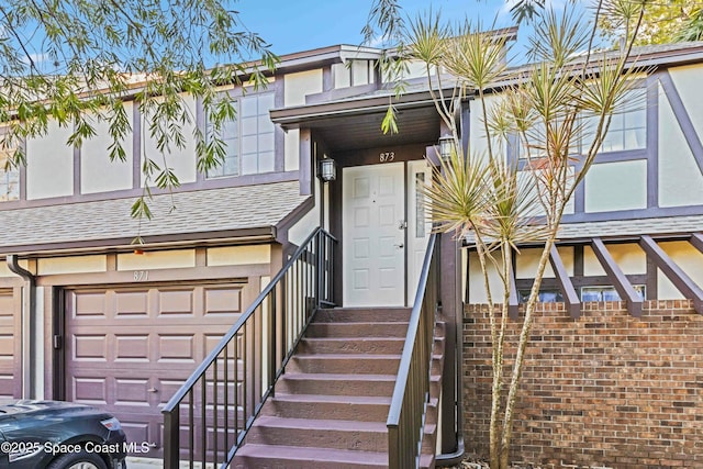 view of exterior entry with a garage