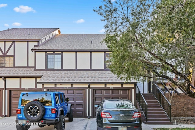 tudor-style house with a garage