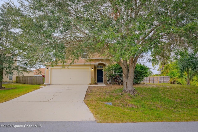 view of property hidden behind natural elements featuring a front lawn