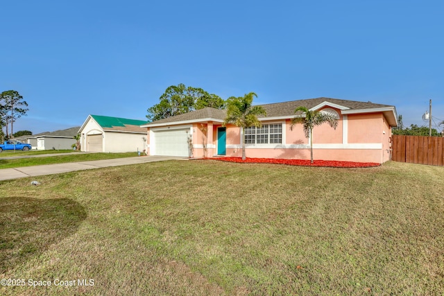 ranch-style house featuring a garage and a front lawn