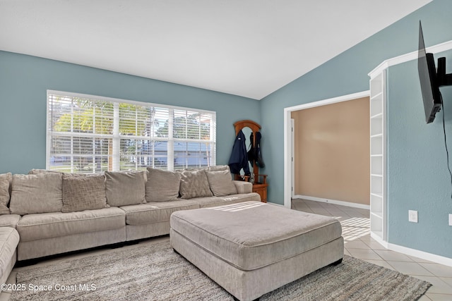 tiled living room featuring vaulted ceiling