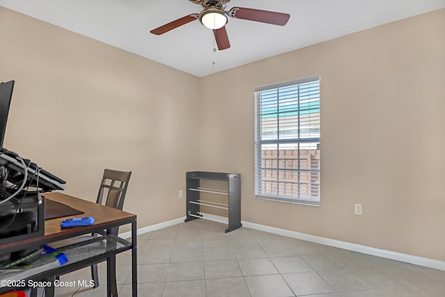 office space with ceiling fan and light tile patterned flooring