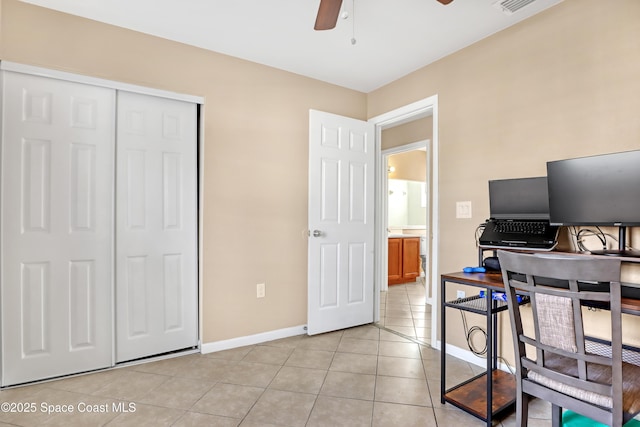 home office with ceiling fan and light tile patterned floors