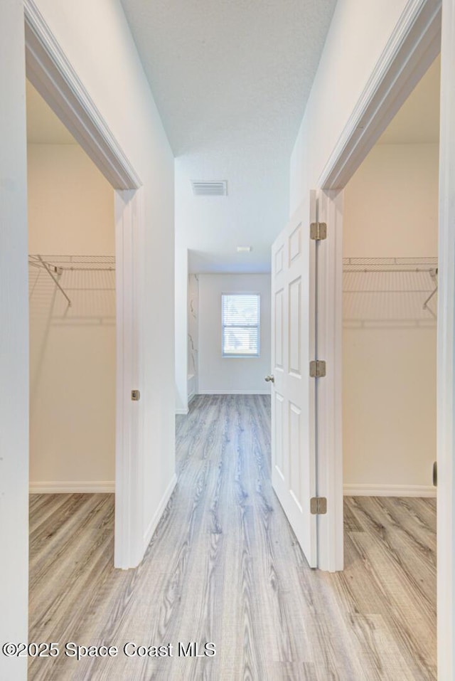 hallway featuring light hardwood / wood-style flooring