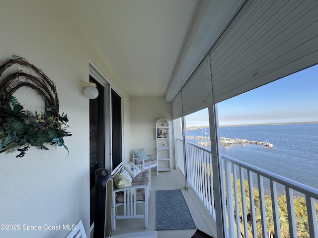 balcony featuring a water view