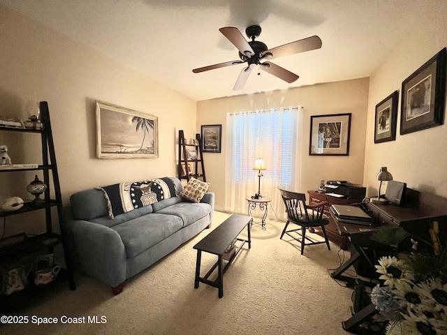 living room featuring ceiling fan and carpet floors