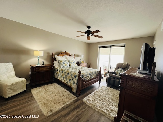 bedroom featuring ceiling fan and dark wood-type flooring