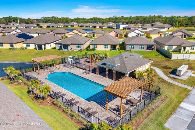 view of pool featuring a pergola, a patio, and a lawn