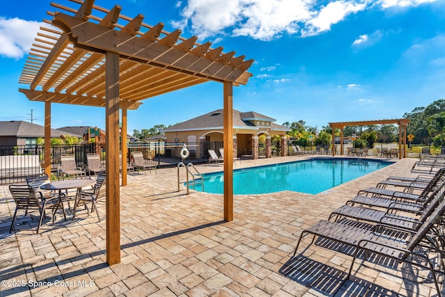 view of swimming pool with a pergola and a patio