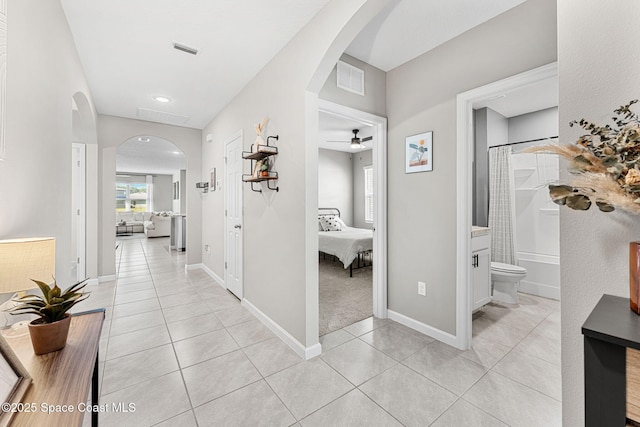 corridor featuring light tile patterned flooring