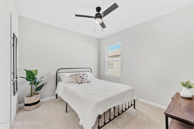 bedroom with light carpet and ceiling fan