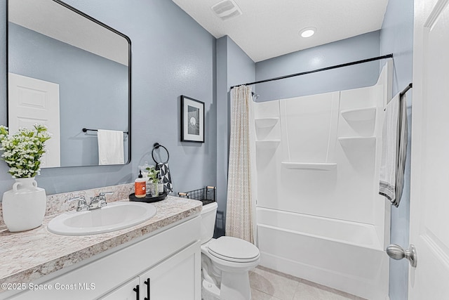 full bathroom with shower / bathtub combination with curtain, tile patterned flooring, a textured ceiling, toilet, and vanity