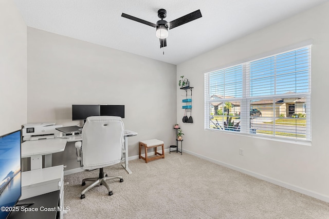 office with ceiling fan and light carpet