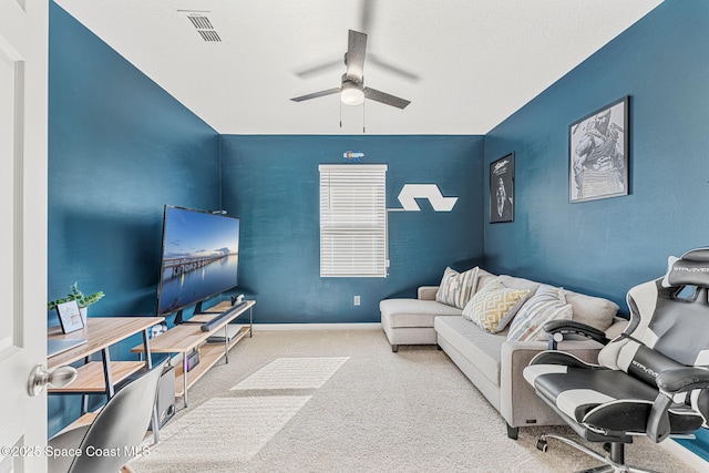 carpeted living room featuring ceiling fan