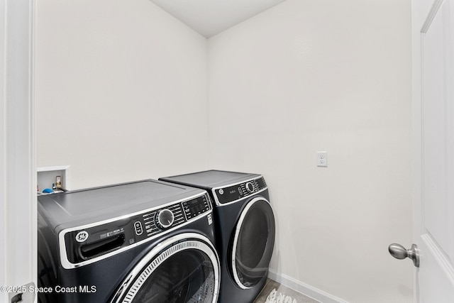 laundry room featuring washing machine and dryer